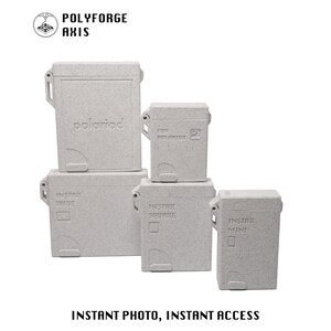 May include: Five light gray speckled rectangular storage cases for instant film, labeled Polyforge Axis and Instant Photo, Instant Access. The cases are embossed with Polaroid, Instax Wide, Instax Square, and Instax Mini text on their front surfaces.