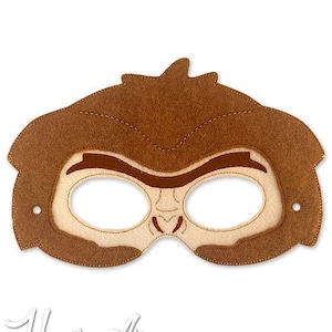 May include: Brown felt monkey mask with eye holes and a stitched-on face. The mask is designed for children's play and costumes.