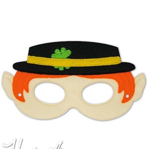 May include: A felt mask of a leprechaun with a black hat, orange hair, and green shamrock. The mask has eye holes and is designed for children's play.