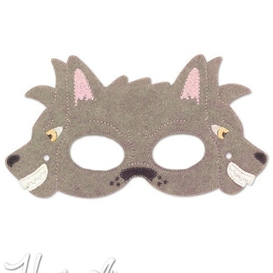 May include: Grey felt wolf mask with eye holes and a stitched smile. The mask has pink felt ears and yellow felt eyes.