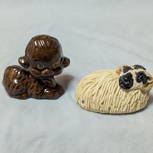 Vintage pair of ceramic pottery sheep figurines, one spaghetti, one redware