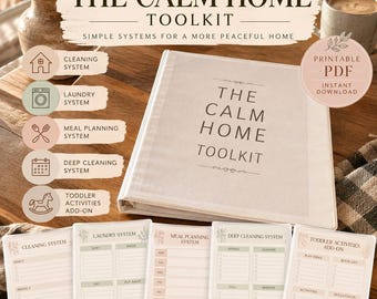 May include: A white three-ring binder titled The Calm Home Toolkit with five matching printed planning sheets displayed in front. The sheets are labeled Cleaning System, Laundry System, Meal Planning System, Deep Cleaning System, and Toddler Activities Add-on.