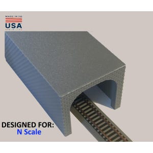 May include: A gray model train tunnel with a textured surface. The tunnel is designed for N scale model trains. The image also includes a section of model train tracks. The text "MADE IN THE USA" is visible.