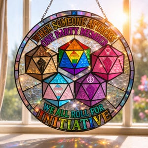 May include: A round stained glass window with a rainbow border and the text "WHEN SOMEONE ATTACKS ONE PARTY MEMBER WE ALL ROLL FOR INITIATIVE." The design features several geometric shapes with various symbols and colors, including a rainbow fist.