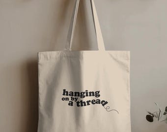 Hanging On By A Thread Tote Bag | Mental Health Humor | Funny Minimalist Canvas Bag
