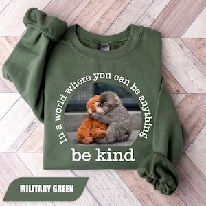 May include: A set of three ceramic mugs with a speckled, matte finish. The mugs are in shades of cream, light gray, and dark gray. Each mug has a simple, minimalist design, perfect for coffee or tea.