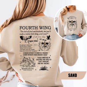 May include: Sand-colored sweatshirt featuring the text "FOURTH WING" and various graphic elements, including a dragon, a castle, and the words "Dragon Rider." The back of the sweatshirt also includes the text "BASGIATH WAR COLLEGE."