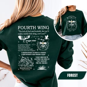 May include: Forest green sweatshirt with white text and graphics. The text includes "FOURTH WING" and quotes like "You look all frail and breakable, but you're really a violent little thing, aren't you?" and "Dragon Rider". The sweatshirt also features the text "BASGIATH WAR COLLEGE".