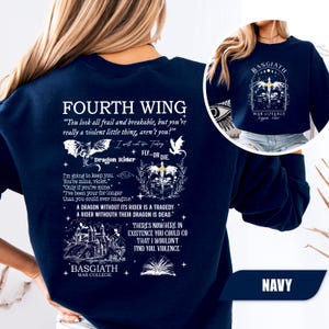 May include: Navy blue sweatshirt featuring the text "FOURTH WING" and quotes. The back design includes illustrations of a dragon, a castle, and the words "Dragon Rider" and "BASGIATH WAR COLLEGE". A smaller image of the design is on the upper right.