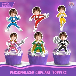 May include: Cupcake toppers featuring Power Rangers characters in various colors, including blue, red, yellow, pink, green, and black. Each topper has a child's face. The cupcakes have purple frosting. Text reads "PERSONALIZED CUPCAKE TOPPERS."