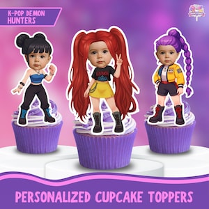 May include: Three personalized cupcake toppers featuring cartoon figures with baby faces, each atop a purple frosted cupcake. The figures are styled in K-Pop fashion, with vibrant hair colors and outfits. Text at the top reads "K-Pop Demon Hunters" and at the bottom "Personalized Cupcake Toppers."