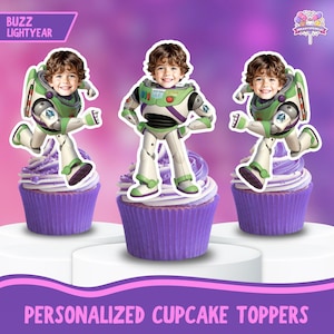 May include: Three cupcakes with purple frosting and Buzz Lightyear-themed toppers. The toppers feature a child's face in a Buzz Lightyear costume. The cupcakes sit on a white platform against a purple gradient background. Text at the top reads "Buzz Lightyear."
