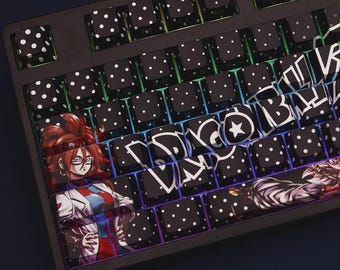 May include: Black mechanical keyboard with custom keycaps. Most keycaps are black with white polka dots. Some keycaps feature anime character art and stylized text. The keyboard has a black frame and a rainbow gradient backlight.