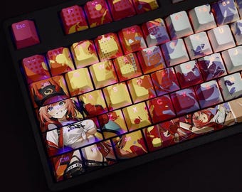 May include: A black mechanical keyboard with custom keycaps featuring anime-style artwork. The keycaps display a variety of colorful designs, including images of a character with red hair and a hat. The keyboard has a standard layout.