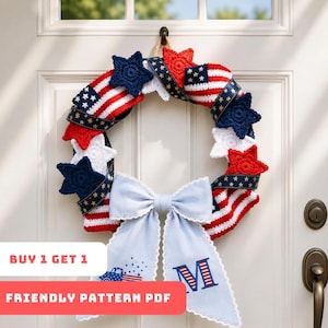 May include: A patriotic wreath with red, white, and blue crochet elements, including stars and a ribbon resembling the American flag. A light blue bow with an embroidered initial and a car graphic is attached. The wreath is hanging on a white door.