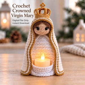 May include: A crochet doll of the Virgin Mary wearing a gold crown and a white cloak with gold trim. The doll features brown hair, black eyes, and a small pocket at the base holding a white LED tea light. Text reads: Crochet Crowned Virgin Mary, Digital File Only, Instant Download.