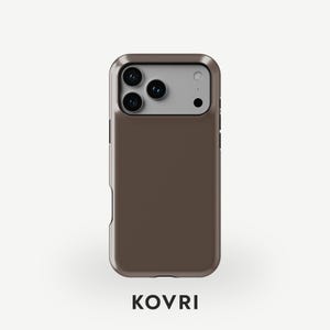 May include: A brown phone case with a metallic finish. The case has a camera cutout with three lenses and a flash. The brand name "KOVRi" is printed in a bold, sans-serif font at the bottom of the case.