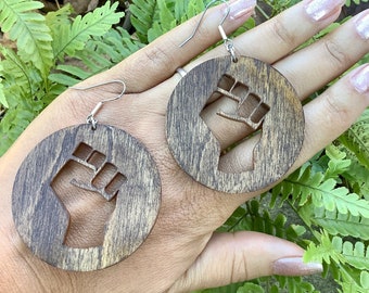 Black power fist wood statement earrings