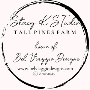 May include: A circular logo with a black brushstroke border. The text reads "Stacy K Studio, Tall Pines Farm, home of Bel Viaggio Designs." The website www.belviaggiodesigns.com is also included, along with a copyright notice.