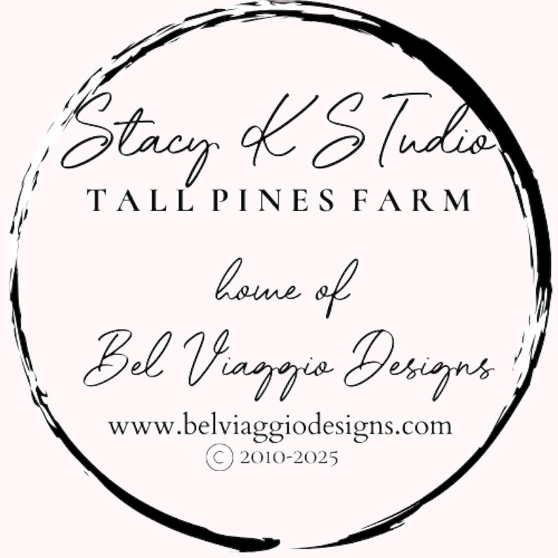 May include: A circular logo with a black brushstroke border. The text reads "Stacy K Studio, Tall Pines Farm, home of Bel Viaggio Designs." The website www.belviaggiodesigns.com is also included, along with a copyright notice.