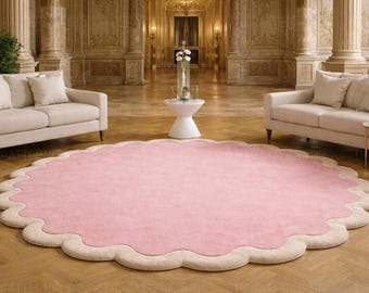 Alfombra de lana rosa con borde festoneado, tejida a mano, redonda, con diseño floral, ideal para la habitación infantil o para decorar un dormitorio femenino.