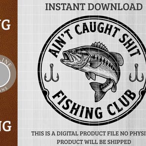May include: Black and white graphic design featuring a fish inside a circular emblem with the text "Ain't Caught Shit Fishing Club." Two fish hooks flank the fish. The words "SVG" and "PNG" are also visible.