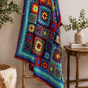 May include: A vibrant, hand-crocheted blanket displayed on a wooden ladder. The blanket showcases a patchwork design with squares in a spectrum of colours: red, orange, yellow, green, blue, and purple. It has a red border. This blanket is a cosy home decor item, perfect for adding colour.