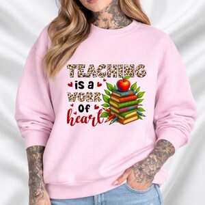 Teaching Is a Work of Heart sweatshirt | Teacher apple stack design