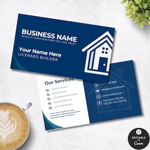 May include: Business card design with a navy blue background and white text. The card features a house icon and the text "BUSINESS NAME" and "Your Name Here". The back of the card lists contact information and services.