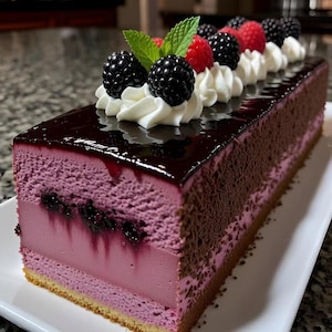 May include: A rectangular dessert with layers of pink and purple mousse, topped with a dark glaze and decorated with fresh blackberries, raspberries, whipped cream, and mint leaves. The cake sits on a white plate.