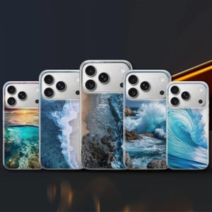 May include: Five clear phone cases with ocean-themed designs. Each case features a different coastal scene, including crashing waves, sandy beaches, and underwater views. The cases have a clear border and a camera cutout.