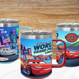 May include: Three stainless steel tumblers featuring Disney Pixar Cars graphics. The left tumbler shows a Japan city scene with a race car and Rust-Eze logo. The center tumbler displays World Grand Prix London text and Lightning McQueen. The right tumbler features the Piston Cup logo.