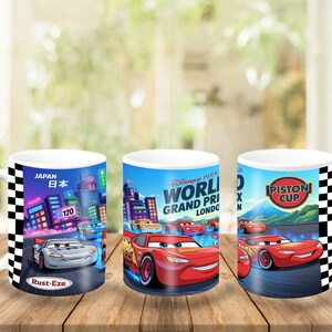 May include: A white ceramic mug featuring a wrap-around graphic of Disney Pixar Cars characters. The design includes Lightning McQueen, a city skyline with the text Japan, the World Grand Prix London logo, and a Piston Cup emblem, all bordered by black and white checkered racing stripes.