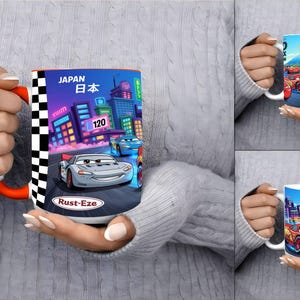 May include: A ceramic mug featuring a colorful graphic of the character Lightning McQueen from the movie Cars. The design includes a city skyline, the text Japan, the number 120, and the Rust-Eze logo, framed by a black and white checkered border.