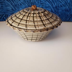 Asian inspired clay glazed pot with leather accent on lid