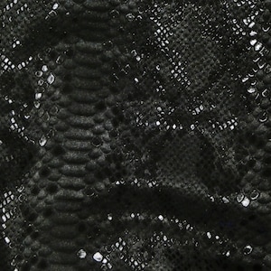 May include: Black faux leather fabric with a snakeskin pattern.