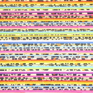May include: A close-up of a stack of colorful nail files with a leopard print design. The files are arranged in a rainbow pattern, with each file having a different color.