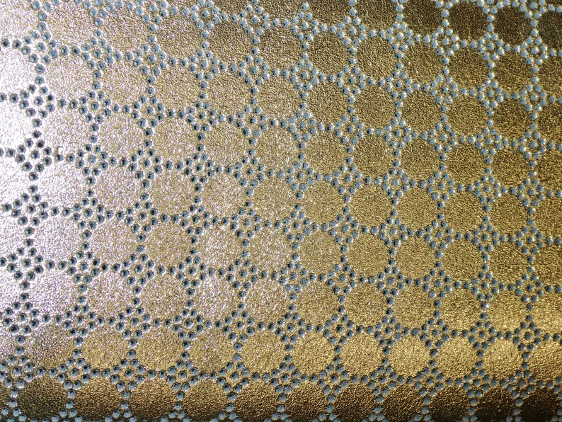 May include: Gold fabric with a repeating pattern of small, silver circles arranged in a hexagonal shape.