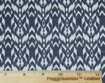 May include: Blue and white patterned fabric with a cork-like texture. The fabric is measured with a ruler showing inches.