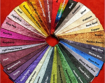 May include: A color chart of leather swatches in various colors, including red, orange, yellow, green, blue, purple, pink, brown, and gray. The swatches are arranged in a circle, with the names of the colors printed below each swatch.