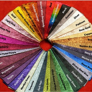 May include: A color chart of leather swatches in various colors, including red, orange, yellow, green, blue, purple, pink, brown, and gray. The swatches are arranged in a circle, with the names of the colors printed below each swatch.