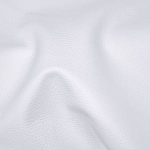 May include: White leather fabric with a textured surface. The fabric is wrinkled and folded.