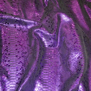 May include: Purple iridescent fabric with a snakeskin pattern.