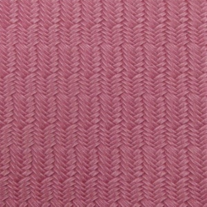 May include: A close-up of a pink woven fabric with a herringbone pattern.