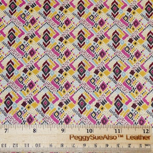 May include: A close-up of a fabric with a geometric pattern in shades of pink, yellow, blue, and gray. The fabric is measured with a ruler that reads "PeggySueAlso™ Leather".