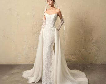 Vestido de novia de encaje de sirena con cola de tul desmontable y hombros descubiertos, hecho a medida