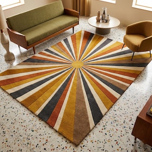 May include: A rectangular rug with a sunburst design in shades of yellow, orange, brown, gray, and white. The rug is placed on a terrazzo floor, and is surrounded by mid-century modern furniture, including a green sofa and a yellow armchair.