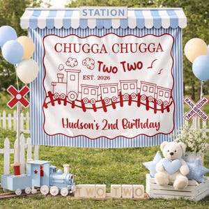 May include: A festive outdoor birthday scene with a blue and white striped backdrop that reads "CHUGGA CHUGGA Two Two Hudson's 2nd Birthday". Includes a wooden train, balloons, a teddy bear, and wooden blocks spelling "TWO TWO".