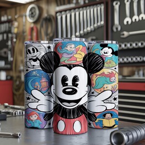 May include: Three stainless steel tumblers featuring Mickey Mouse and various Disney character illustrations. The tumblers have a black and white Mickey Mouse design in the center, with colorful panels of Disney scenes around the sides.