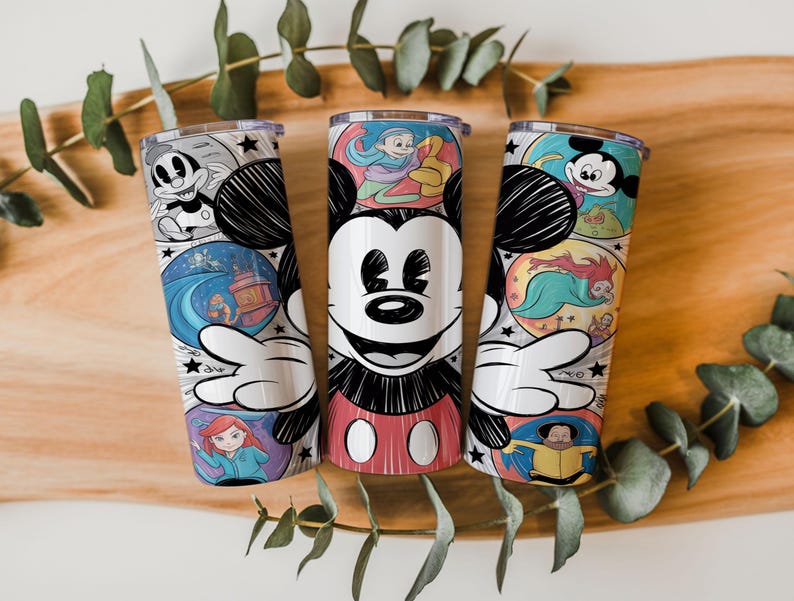 May include: Three stainless steel tumblers with colorful cartoon character designs. Each tumbler features a different Mickey Mouse design, with illustrations of various characters and scenes. The tumblers are cylindrical and have clear lids.